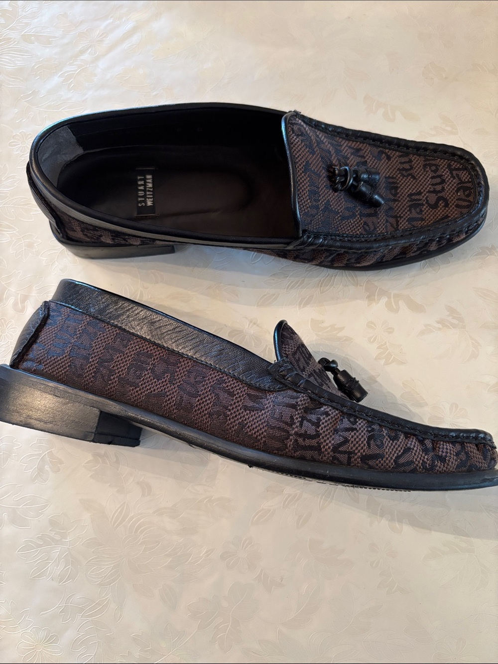 Stuart Weitzman brown monogram-print leather loafers with tassels. Size 8.